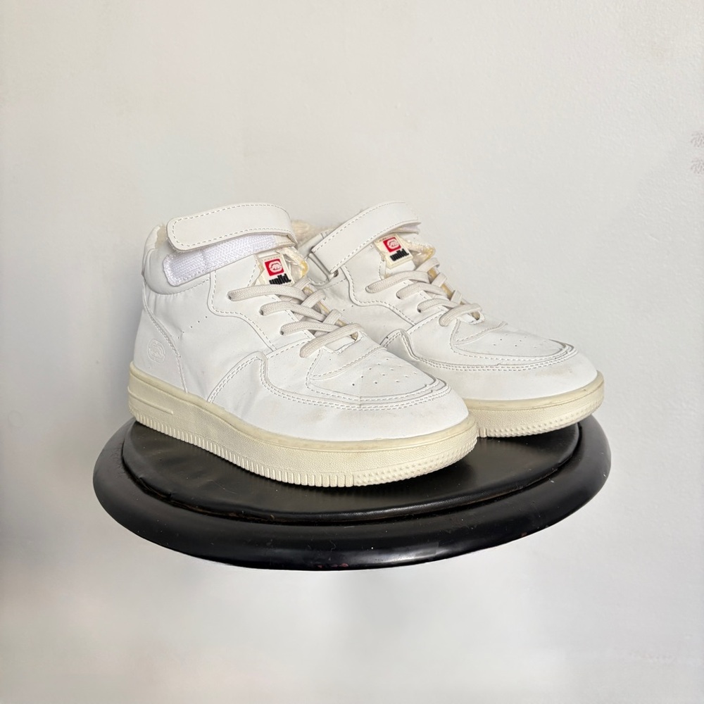 White ecko high top sneakers.